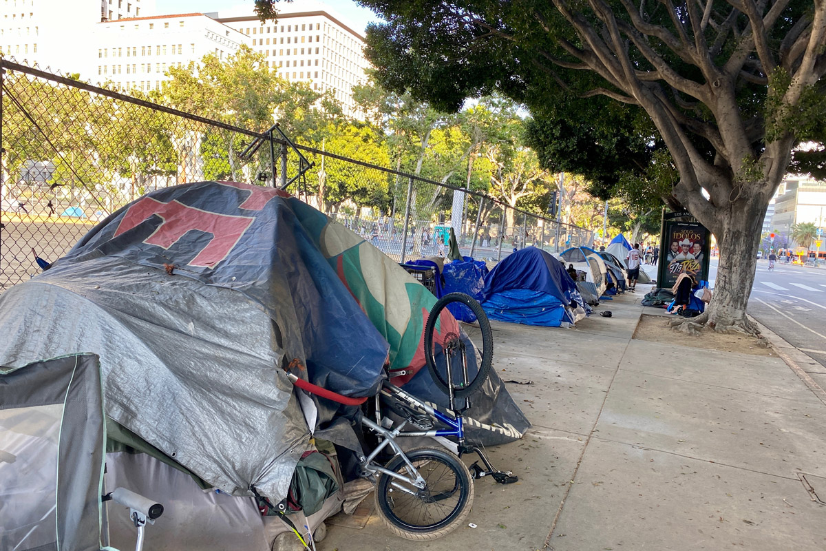 homeless people pitch tents on the streets